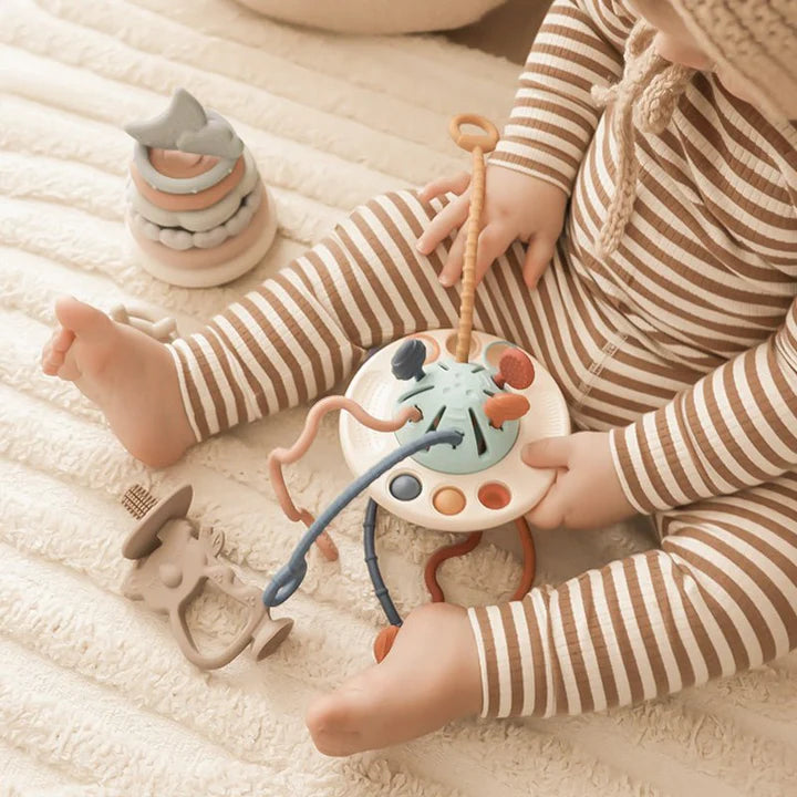 Nestwell Baby UFO silicone pulling toy - in use